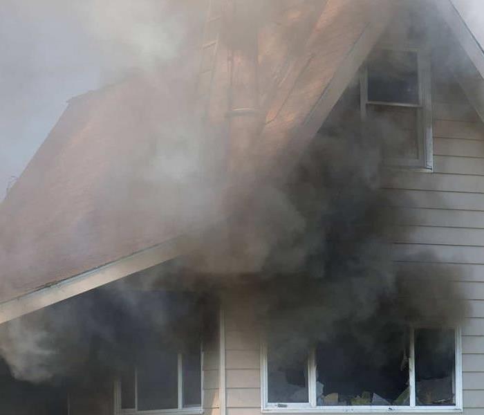 smoke filled house after fire